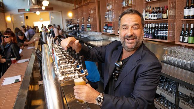 Molloy behind the bar at his Hotel Railway pub in Brunswick. Picture: Mark Stewart