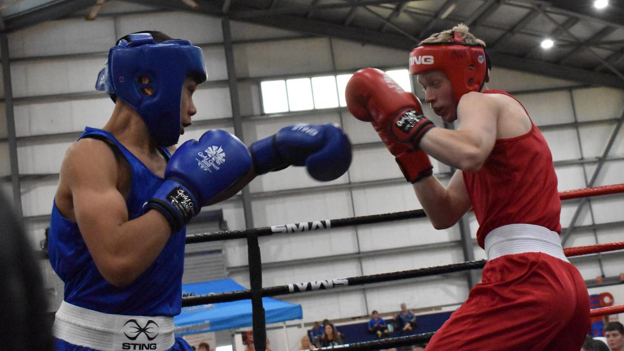 Archer Street's Dakai Rarasea (blue) and Geale Fitness's Jay Peachy at the Reef 'n' Beef Fight Night, Bravus Arena, Rockhampton, on October 21, 2023.