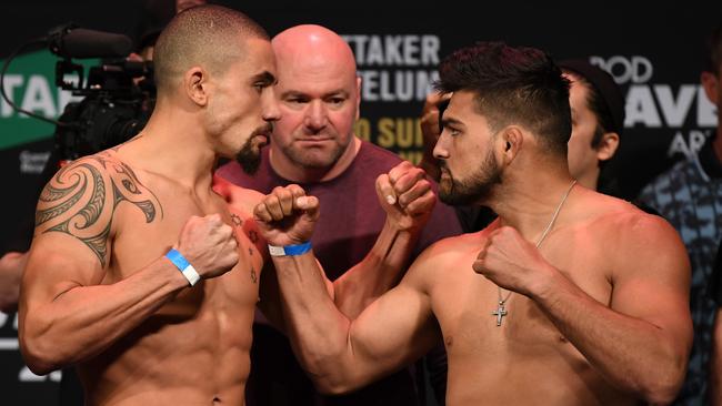 Robert Whittaker (left) and Kelvin Gastelum face off in Melbourne in February. Picture: Getty Images