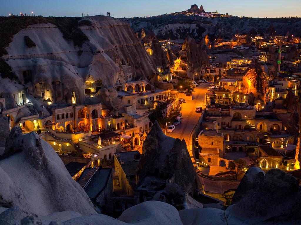 Light illuminates cave hotels at sunset in the town of Goreme on April 17, 2016 in Nevsehir, Cappadocia, Turkey. Picture: Getty