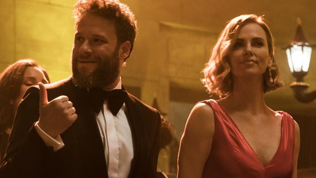 This image released by Lionsgate shows Seth Rogen, left, and Charlize Theron in a scene from 