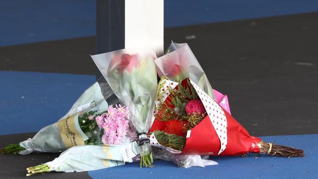 Flowers left at the scene Sunday morning. Picture Lachie Millard