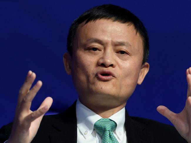 Alibaba Group Founder and Executive Chairman, China's Jack Ma speaks during a panel session on the second day of the World Economic Forum, on January 18, 2017 in Davos.    / AFP PHOTO / FABRICE COFFRINI