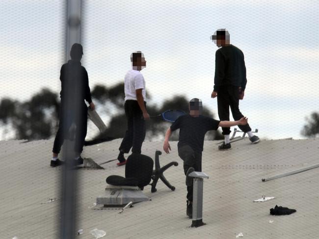 Detainees are seen during a riot at the Frank Baxter Juvenile Justice Centre, Kariong, NSW, Monday, July 22, 2019. A riot has broken out at a NSW juvenile justice centre on the Central Coast where several inmates have climbed onto the roof and five inmates have been stabbed. Picture: AAP / Dean Lewins