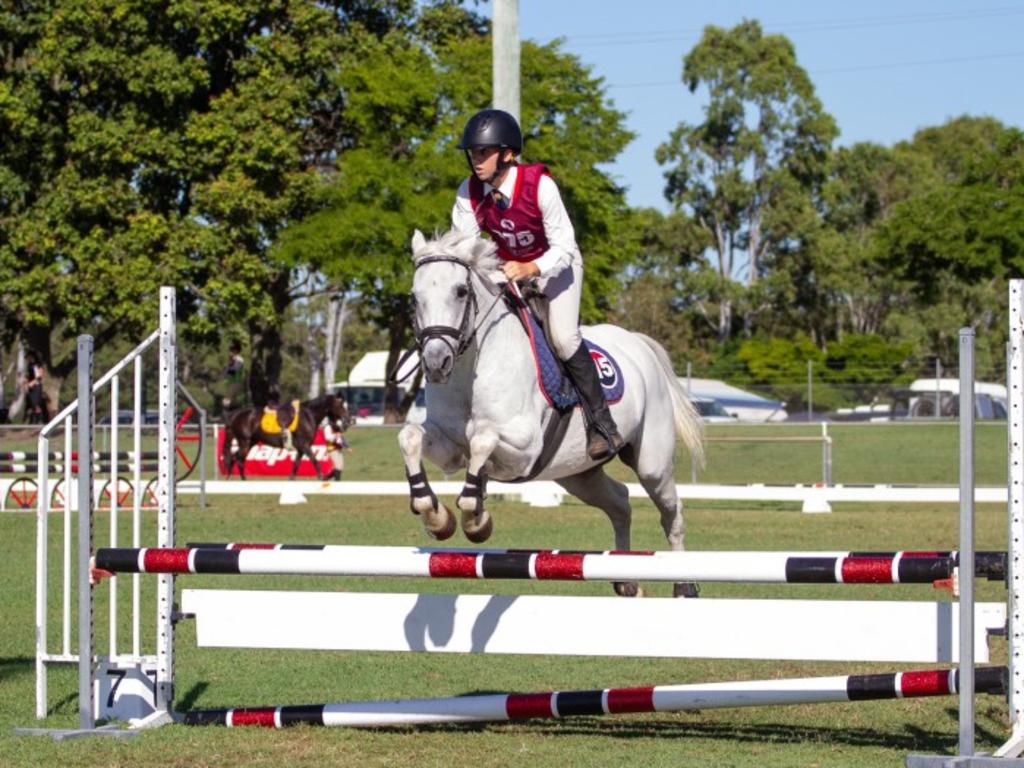 Jessica Cheal and her pony Jum Jum Express clear the oxer at the 2023 PQC State Showjumping Championships.