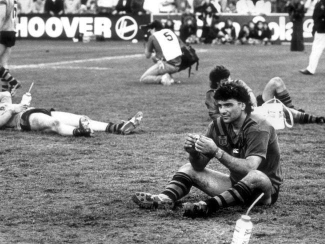 Benny Elias and other devestated Balmain players are scattered across the field in despair after losing the grand final.