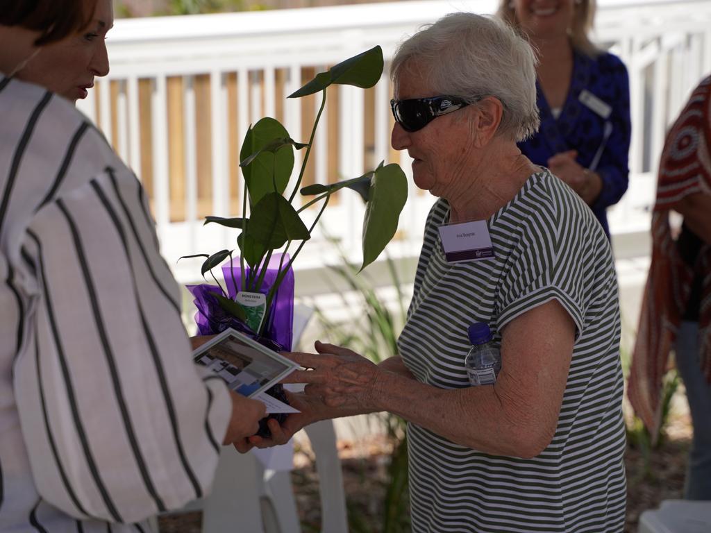 89-year-old tenant Ana Bosjnak receiving a houseplant at the opening of the new Palmer St social housing complex named Mary Ann Sam in North Mackay, December 14, 2021. Picture: Lillian Watkins