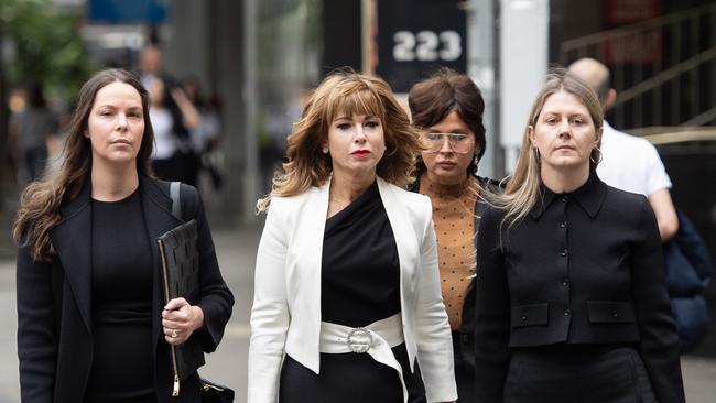 Emma Walters (centre), the estranged wife of John Setka, arrives at Melbourne Magistrates Court on Friday with her lawyers. Picture: NCA Newswire / Nicki Connolly