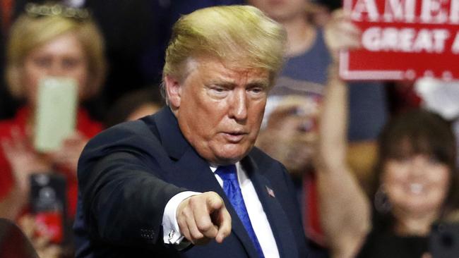 President Donald Trump reacts to supporters as he leaves a rally Tuesday, Oct. 2, 2018, in Southaven, Miss. (AP Photo/Rogelio V. Solis)