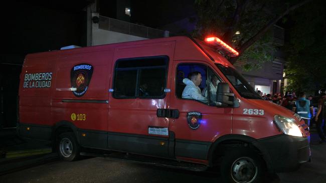 Forensic workers take the body of British singer Liam Payne on a fire van from the hotel where he died. Picture: AFP