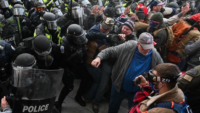 Riot police push back a crowd of supporters of US President Donald Trump after they stormed the Capitol building on January 6. Picture: AFP