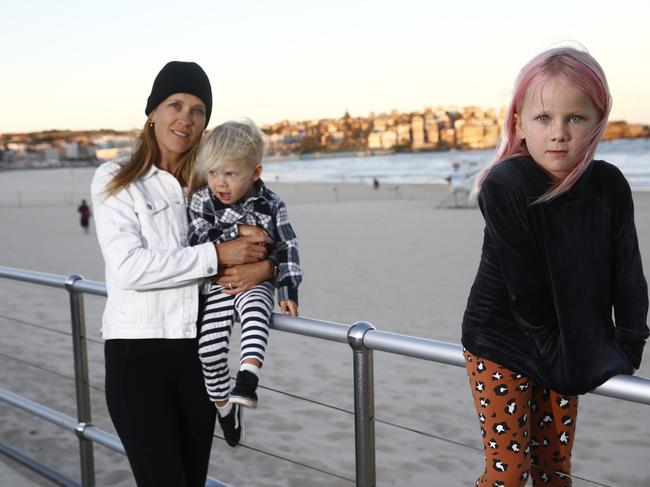 Carrie Christensen, with her children Spike Fahey (2) and Coco Fahey (5), were turned away from the beach in a teary state this week. Picture: John Appleyard