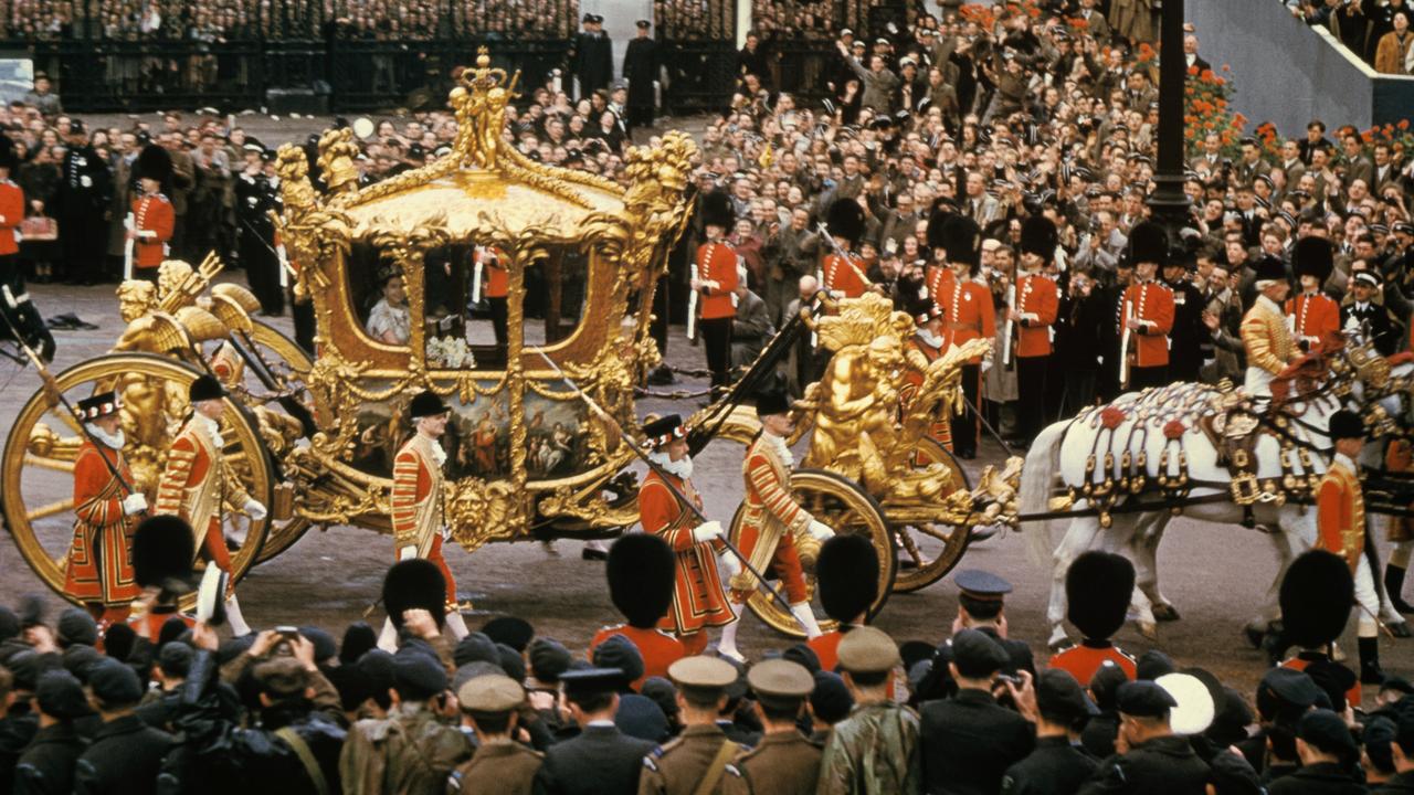 After the ceremony, the Queen returned to Buckingham Palace along a 7.2km route designed to ensure as many people as possible could view the procession. The weather was unseasonal, but nothing would dampen the patriotic fervour on a day when it was also announced that Edmund Hillary and Tenzing Norgay had reached the summit of Mount Everest. Picture: Getty