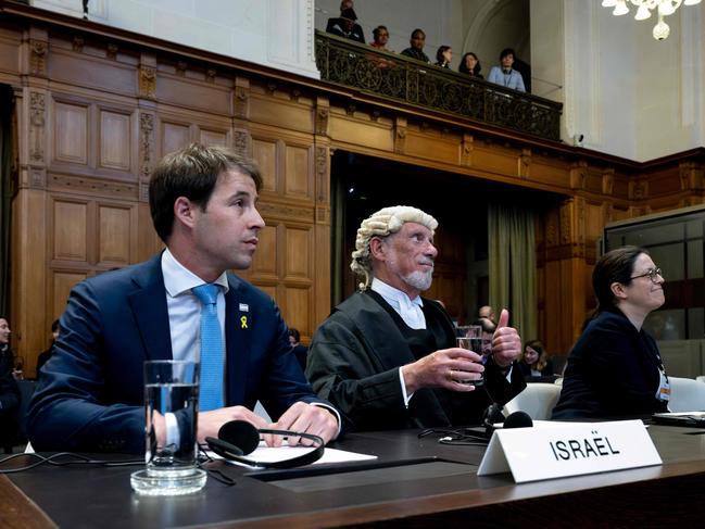 (L-R) Yaron Wax, deputy of mission for Israeli embassy in the Netherlands, lawyer and member of Israel's legal team, Malcolm Shaw KC and Member of Israel's legal team Avigail Frisch Ben Avraham attend a hearing at the International Court of Justice. Picture: AFP