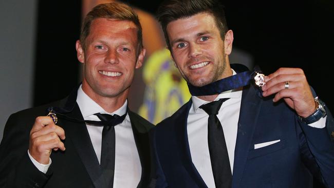 Sam Mitchell accepting his Brownlow Medal with Trent Cotchin. Picture: Getty Images