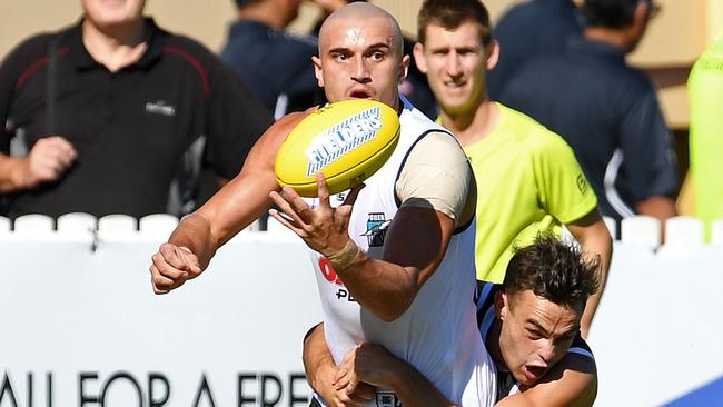 Port Adelaide’s Karl Amon tackles Sam Powell-Pepper. Picture: Tom Huntley