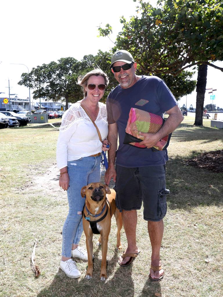 Nicci Taylor and Glen Stokes Petrie with pup Bodhi at Sandgate Beach. Picture: Steve Pohlner