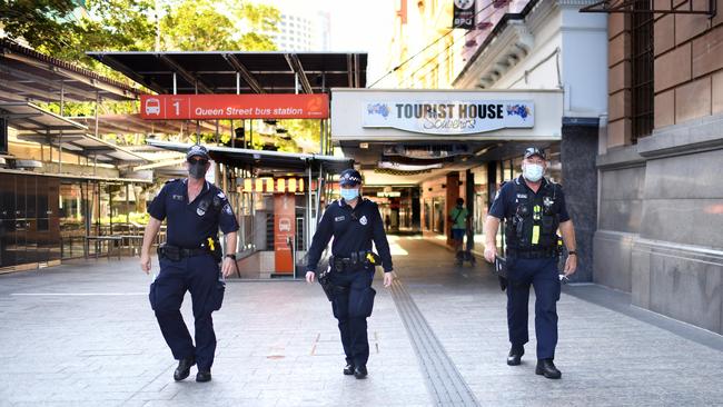 Police officers patrol Queen Street Mall in central Brisbane. Picture: NCA Newswire / Dan Peled