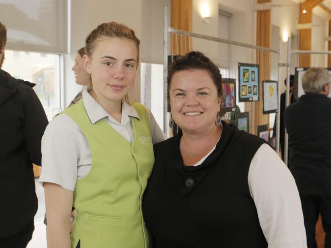 Anika de Kramer, 16, and Natasha Harris of Kingston at the St Aloysius school art exhibition in Mawson Place. Picture: Matthew Farrell