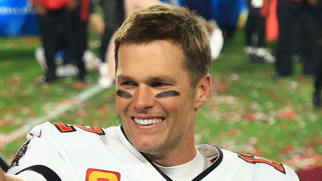 (FILES) In this file photo taken on February 07, 2021, Tom Brady of the Tampa Bay Buccaneers celebrates after defeating the Kansas City Chiefs in Super Bowl LV at Raymond James Stadium in Tampa, Florida. - Brady has agreed to a contract extension with the Tampa Bay Buccaneers that will enable the Super Bowl champions to keep other top players, according to multiple reports on March 12, 2021. (Photo by Mike Ehrmann / GETTY IMAGES NORTH AMERICA / AFP)