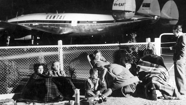 The Barrett family from Eltham and the Fells family from Middle Park, camped overnight at Essendon Aerodrome to secure a prime spot for Queen Elizabeth and Prince Philip's arrival to Melbourne in 1954. Picture: HWT Library.