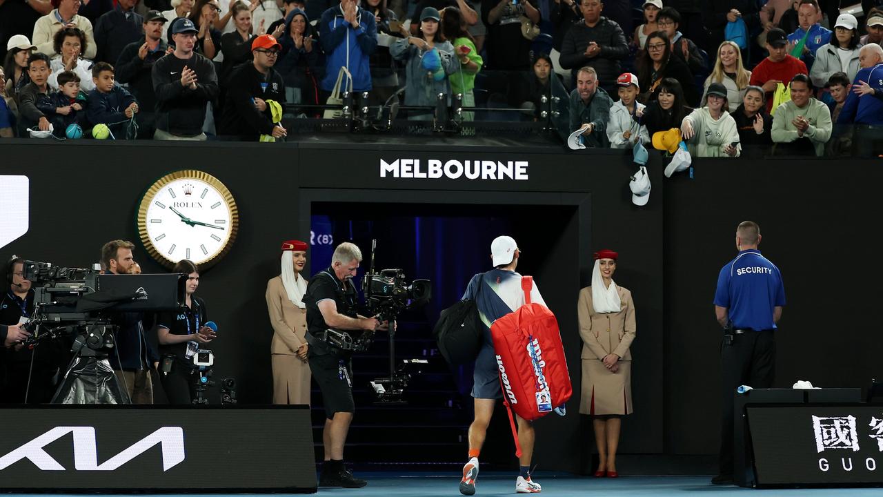 Fans applaud Alex de Minaur as he leaves the court. (Photo by Cameron Spencer/Getty Images)