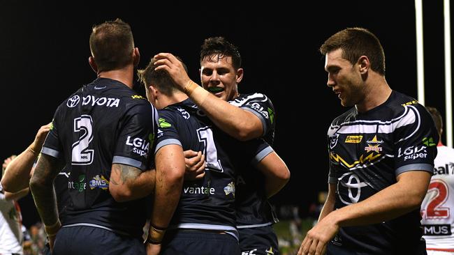 Cowboys fullback Scott Drinkwater is congratulated by teammates after scoring his first try for the club. Picture: AAP