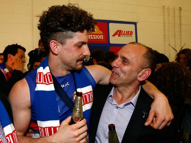 Tom and Tony Liberatore soak up Western Bulldogs’ premiership win in 2016. Picture: Adam Trafford/AFL Media/Getty Images