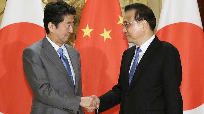 Shinzo Abe, left, meets Li Keqiang in Chengdu on Wednesday. Picture: AP