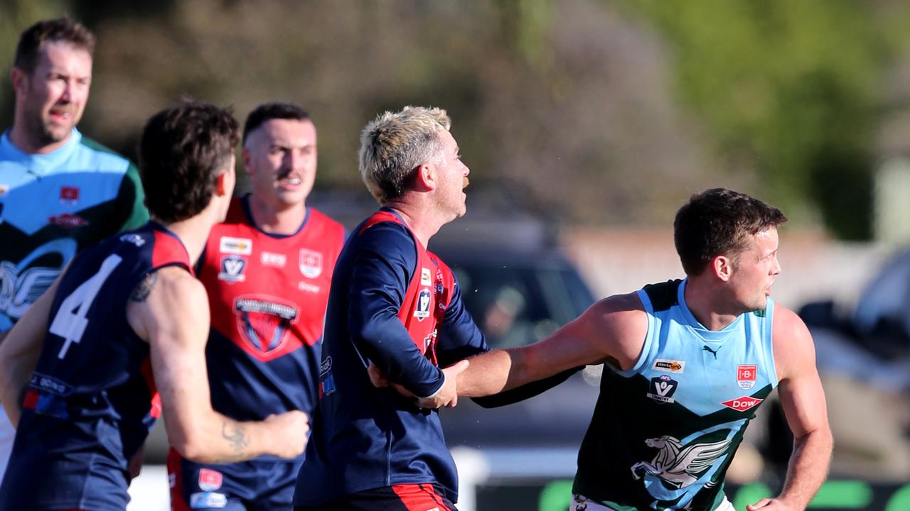 BFNL - Portarlington v Geelong Amateurs.  Ammos Blake Sutterby and Port's Tiea Miles battle it out in the centre. Picture Mike Dugdale