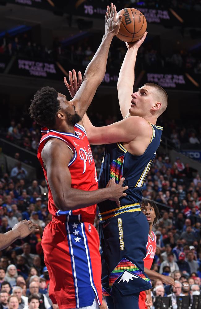 Philadelphia 76ers centre Joel Embiid blocks a shot from Nikola Jokic of the Denver Nuggets during an NBA game this week. Picture: David Dow/NBAE via Getty Images