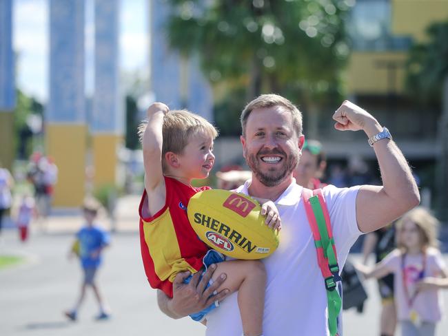 Ramon Palomar takes his son, Freddy (3), to his first AFL game as the Gold Coast Swans take on the Sydney Swans at People First Stadium, Carrara. Picture: Glen Campbell