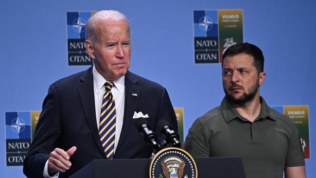 Joe Biden speaks alongside Volodymyr Zelensky during a G7 declaration of joint support for Ukraine.