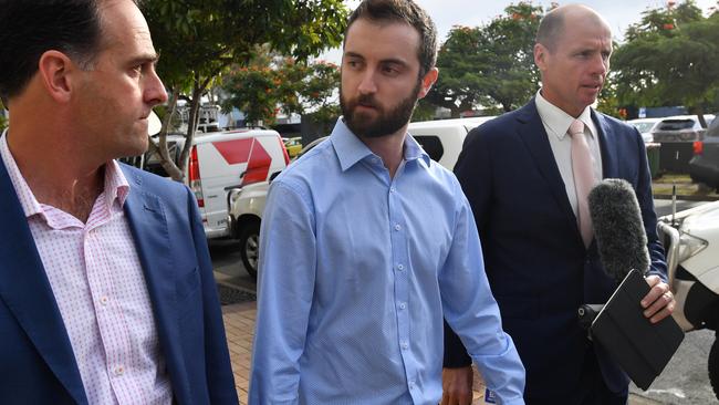 Dreamworld ride operator Timothy Williams (centre) leaving the inquest into the Dreamworld disaster at the Southport Courthouse. Picture: AAP Image/Darren England