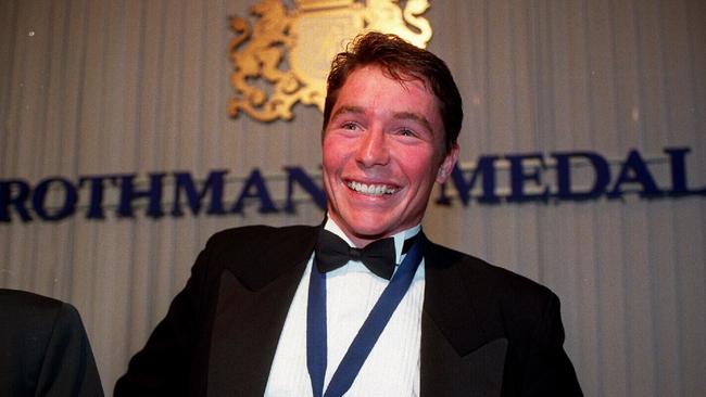 Cronulla RL player Paul Green, winner 1995 Rothmans medal, displaying award.