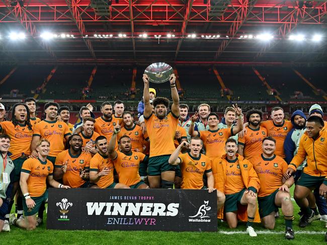 CARDIFF, WALES - NOVEMBER 17: Rob Valetini of Australia lifts the James Bevan Trophy as players of Australia celebrate victory after defeating Wales during the Autumn Nations Series 2024 match between Wales and Australia at the Principality Stadium on November 17, 2024 in Cardiff, Wales. (Photo by Dan Mullan/Getty Images)