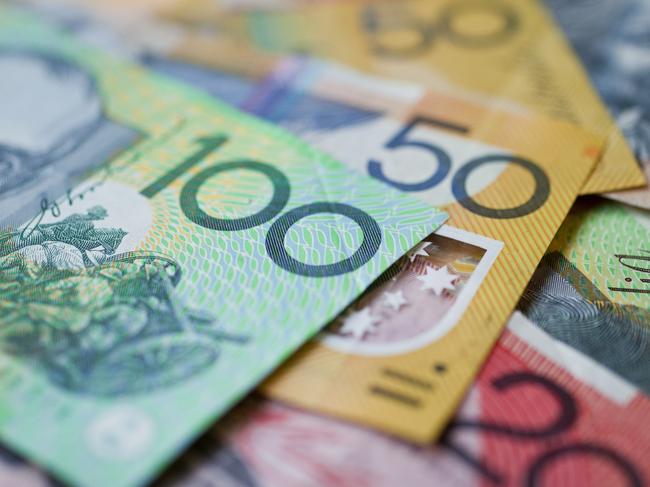 Australian money background showing $100, $50 and $20 notes with a shallow depth of field.