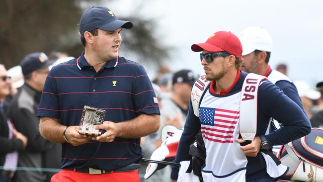 Patrick Reed with caddie Kessler Karain, who has been stood down for the final day of the Presidents Cup. Picture: Getty Images