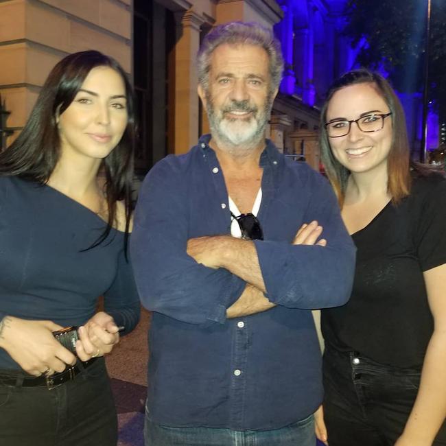 Mel Gibson at the Treasury Casino in Brisbane City on Thursday night with local bar workers Chloe (left) and Chelsey (right). Photo: Instagram / @chelsbeaulieu