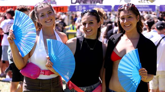 Maya Castronini, Zara Parletta and Marietta Lalidis with their brilliant blue fans. Picture: NCA NewsWire / Kelly Barnes