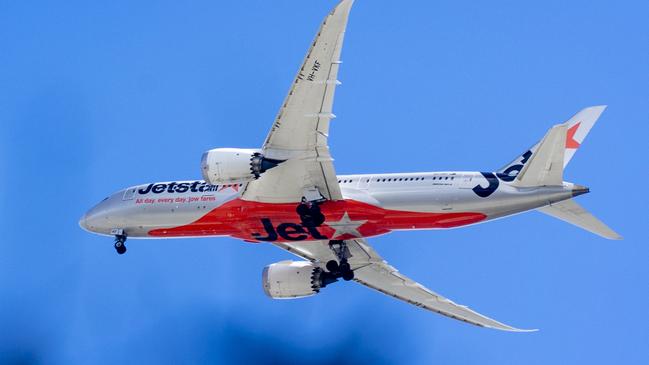 BRISBANE AUSTRALIA - NewsWire Photos SEPTEMBER 6, 2022: A Jetstar plane leaves Brisbane Airport. Hundreds of Australians are stranded in Bali after multiple Jetstar flight cancellations leave travellers scrambling to find emergency accommodation. NewsWire / Sarah Marshall