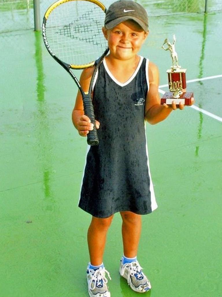 Ash Barty was destined for greatness from a young age. This photo gets trotted out far more than the tennis star would like, and first went viral when she won her maiden grand slam at the French Open in 2019. Not a lot has changed for Barty, who still spends most of her life with a tennis racquet in one hand and a trophy — or perhaps a celebratory beer — in the other. Picture: ashbarty/Instagram.