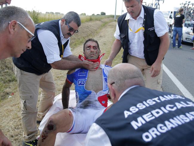 Bonnet is carried onto a stretcher.