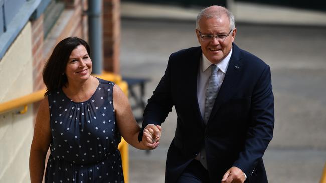 Prime Minister Scott Morrison and wife Jenny arrive at a Liberal National Party campaign rally in Brisbane, yesterday. Picture: AAP 