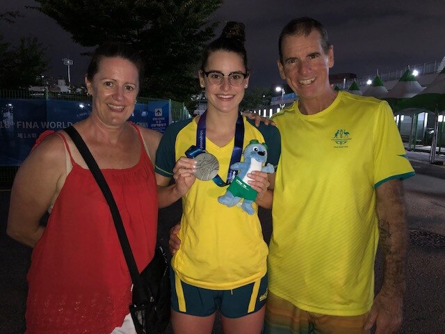 Kaylee with her parents Sharon and Sholto after her silver medal in the 200 backstroke at the World Champs in Gwangju, South Korea. Picture: Supplied