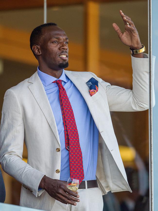 Usain Bolt watches at Flemington on Oaks Day 2016. Picture: Stefan Postles, Getty Images.