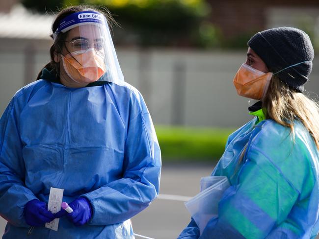 SYDNEY, AUSTRALIA - Newswire Photos JULY 20, 2021: Nurses are seen working at the 24 hour Maud Street drive through Covid Testing clinic at Endeavour Sports Reserve Fairfield West, which is now considered to be the centre of the outbreak and essential workers are required to be tested every 3 days in Sydney. Picture: NCA Newswire /Gaye Gerard