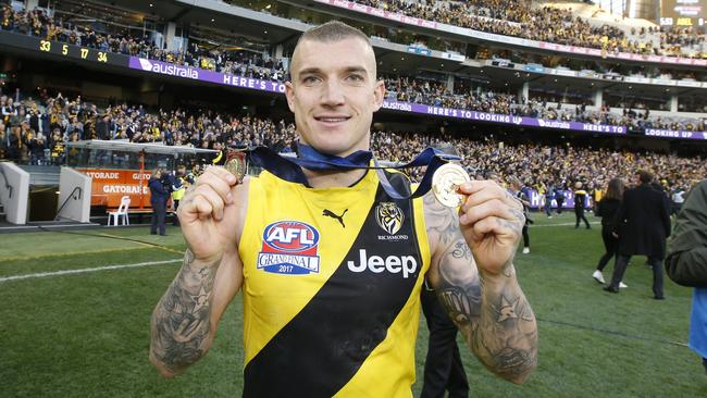 Dustin Martin with the Norm Smith and premiership medals. Picture: Picture: David Caird