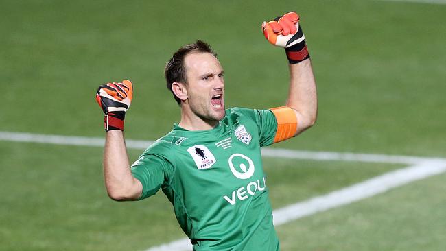 Eugene Galekovic celebrates after Adelaide wins the FFA Cup final.