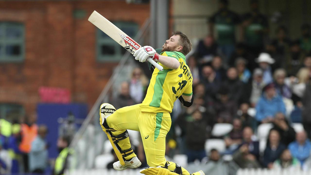 Australia's David Warner celebrates his century.